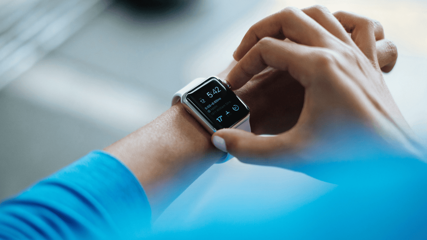 Person checking the time and notifications on a smartwatch.
