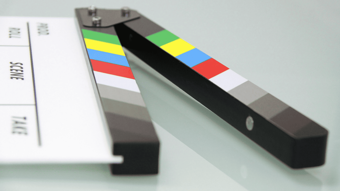 Close-up of a colorful film clapperboard used for marking scenes in video production