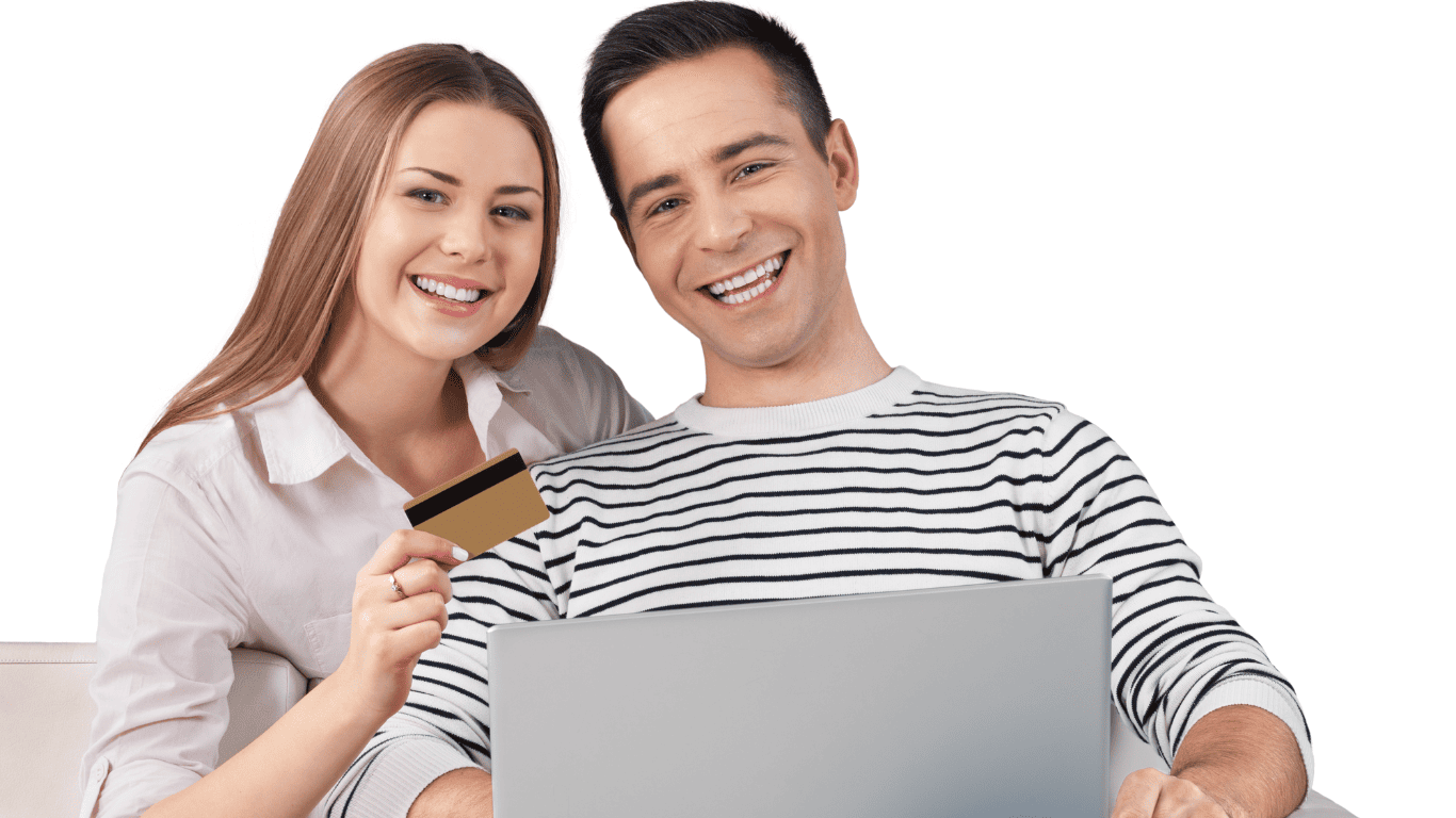 Smiling couple shopping online with a laptop and holding a credit card.
